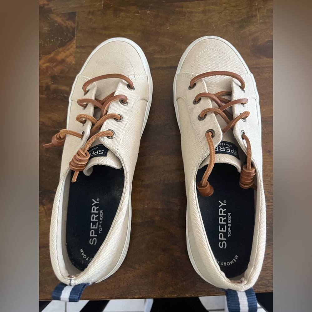 Size 8 Sperry slip on sneaker. Tan with brown and blue accents.